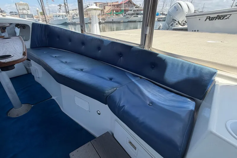 Slide: The Image of Interior of a 1996 Duffy Classic 21 boat with blue cushioned seating. - 17
