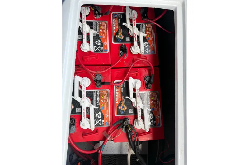 Slide: The Image of Red batteries in a 1996 Duffy Classic 21 boat compartment. - 27