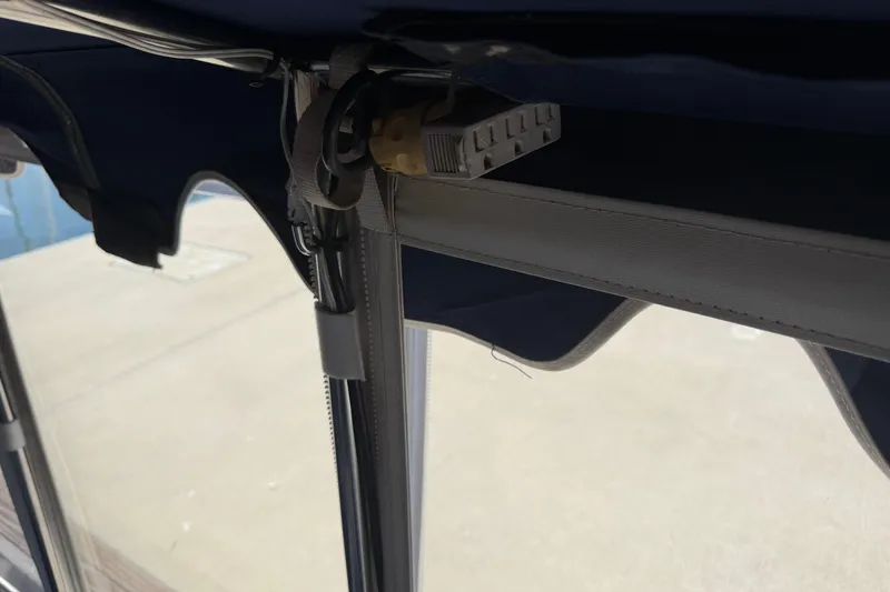 Slide: The Image of Interior view of a 1996 Duffy Classic 21 boat canopy with electrical outlet. - 28