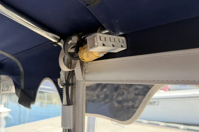 Slide: The Image of Power outlet and wiring inside a 1996 Duffy Classic 21 boat canopy. - 29