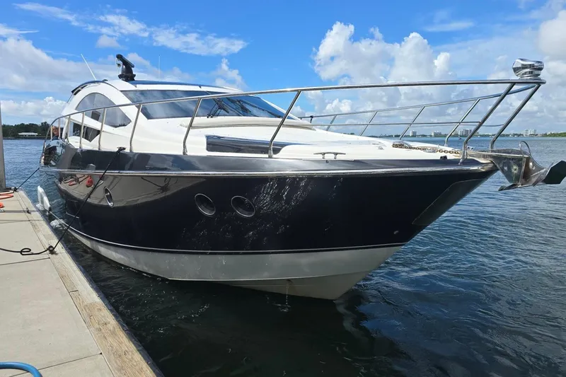 Slide: The Image of Luxury 2009 Marquis 500 Sport Coupe yacht docked on a sunny day. - 1