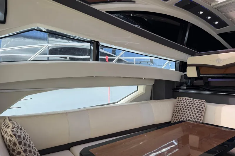 Slide: The Image of Luxurious interior of a 2009 Marquis 500 Sport Coupe yacht with elegant seating. - 11