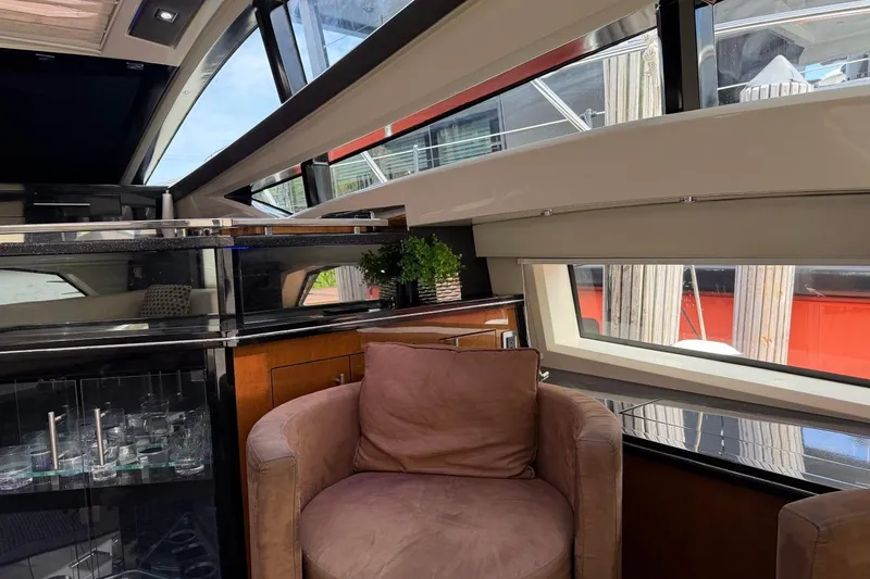 Slide: The Image of Luxurious interior of a 2009 Marquis 500 Sport Coupe yacht with plush seating and modern design. - 12