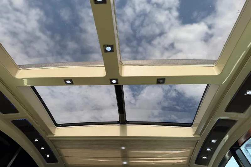 Slide: The Image of Sunroof view from 2009 Marquis 500 Sport Coupe, showcasing sky and clouds. - 13