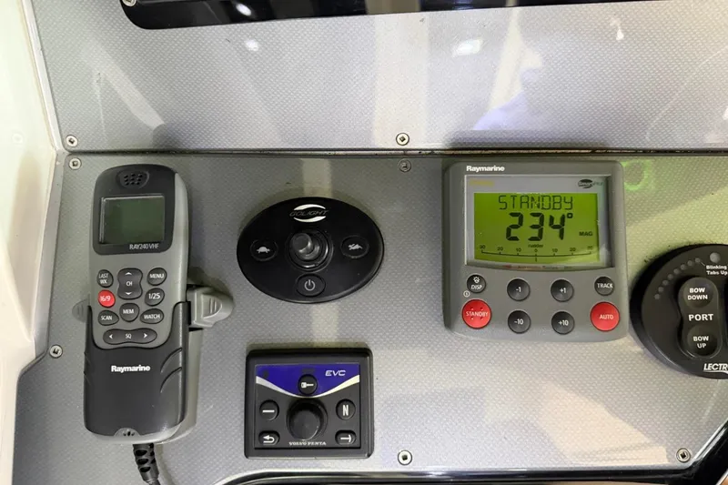 Slide: The Image of Control panel of a 2009 Marquis 500 Sport Coupe with Raymarine navigation equipment. - 15