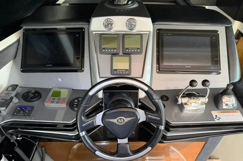 Slide: The Image of Control panel of a 2009 Marquis 500 Sport Coupe with advanced navigation systems. - 16