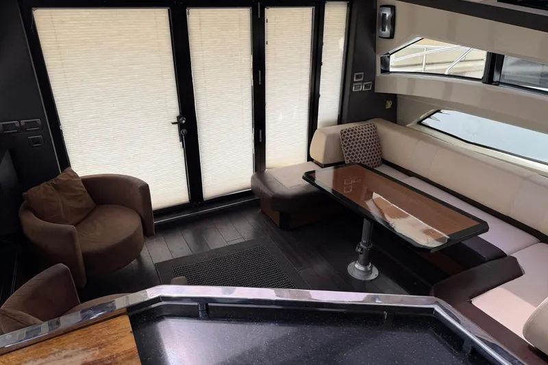 Slide: The Image of Luxurious interior of 2009 Marquis 500 Sport Coupe yacht with elegant seating and table. - 18