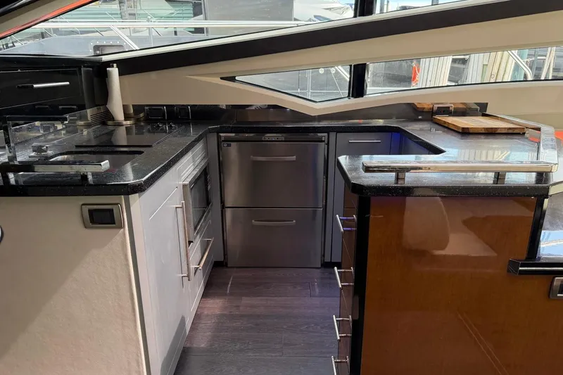 Slide: The Image of Luxurious kitchen interior of 2009 Marquis 500 Sport Coupe yacht with modern appliances. - 19