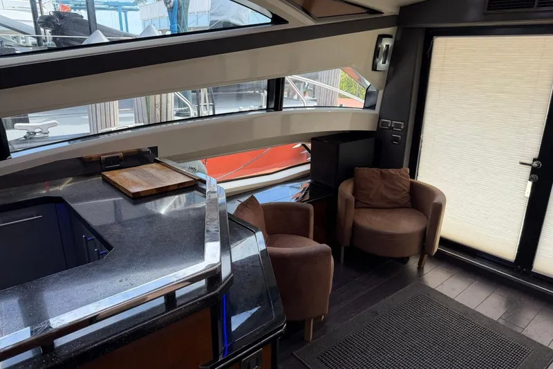 Slide: The Image of Luxurious interior of 2009 Marquis 500 Sport Coupe yacht with modern seating and sleek design. - 20
