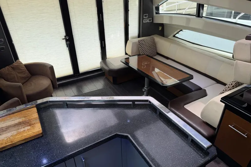 Slide: The Image of Luxurious interior of a 2009 Marquis 500 Sport Coupe yacht with modern seating and sleek design. - 21
