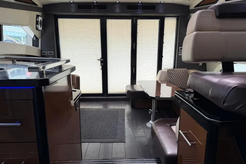 Slide: The Image of Interior of a 2009 Marquis 500 Sport Coupe yacht with modern furnishings. - 22