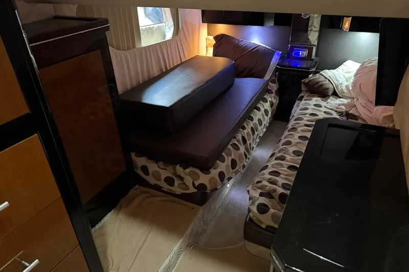 Slide: The Image of Interior of a 2009 Marquis 500 Sport Coupe with cozy sleeping area and modern furnishings. - 23
