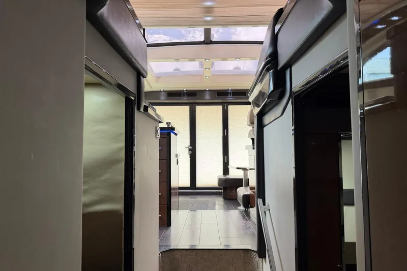 Slide: The Image of Interior view of a 2009 Marquis 500 Sport Coupe yacht, featuring modern design and skylight. - 25