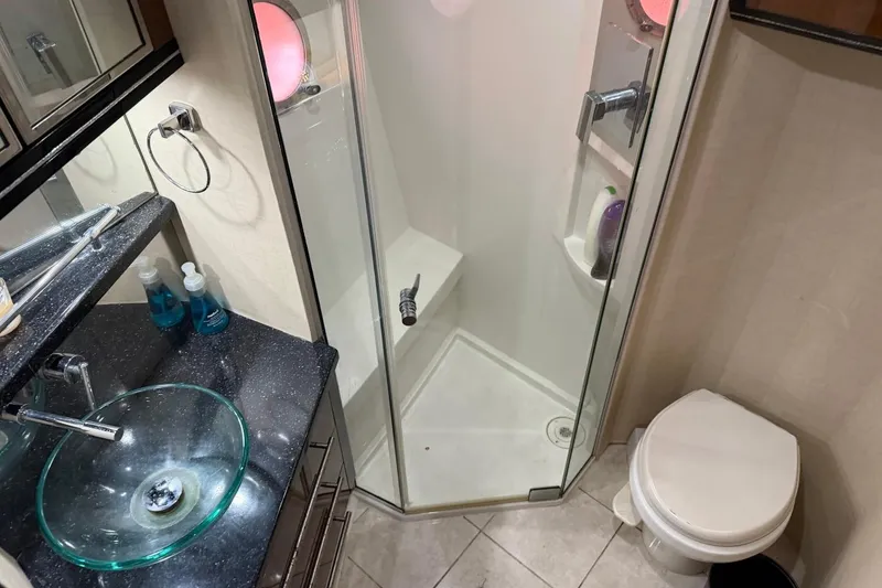Slide: The Image of Luxurious 2009 Marquis 500 Sport Coupe bathroom with glass sink and shower. - 27