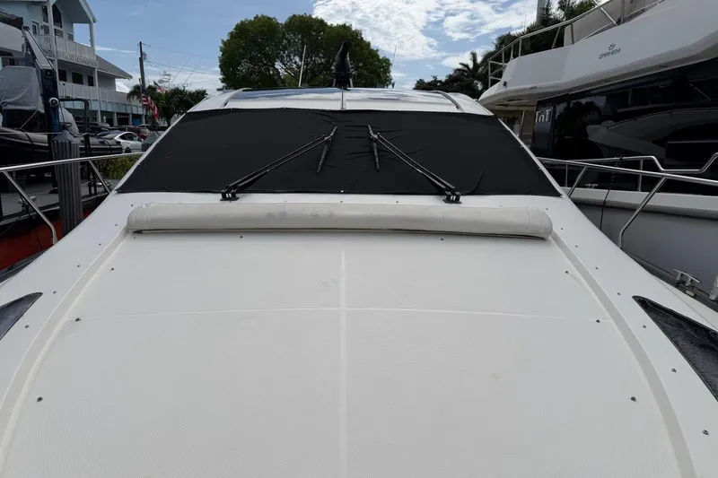Slide: The Image of 2009 Marquis 500 Sport Coupe yacht with covered windshield, docked in marina. - 5
