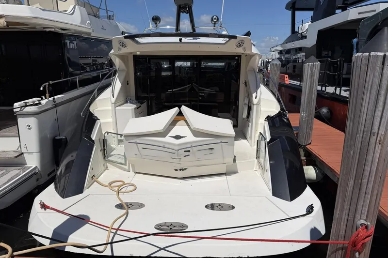 Slide: The Image of 2009 Marquis 500 Sport Coupe yacht docked at marina, rear view. - 6