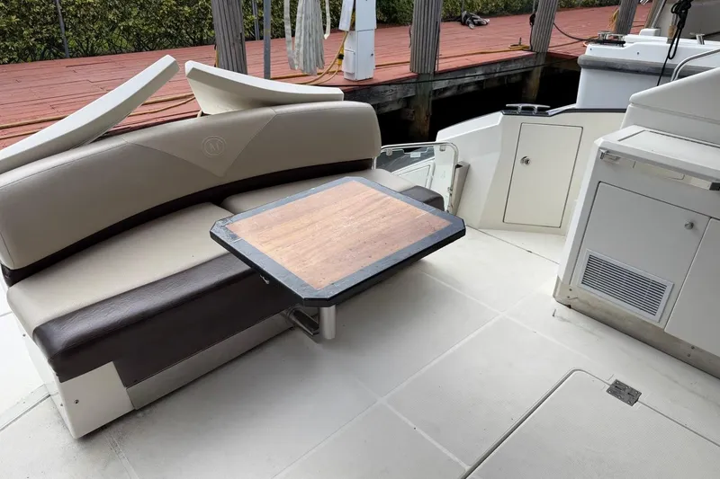 Slide: The Image of Interior of 2009 Marquis 500 Sport Coupe with seating and wooden table. - 9