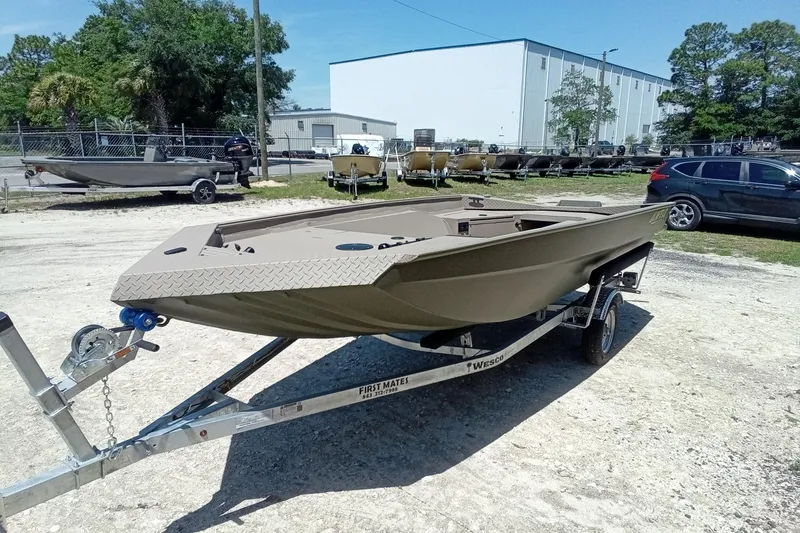 Slide: The Image of 2026 Alweld 1652 Invader boat on trailer in outdoor lot. - 4