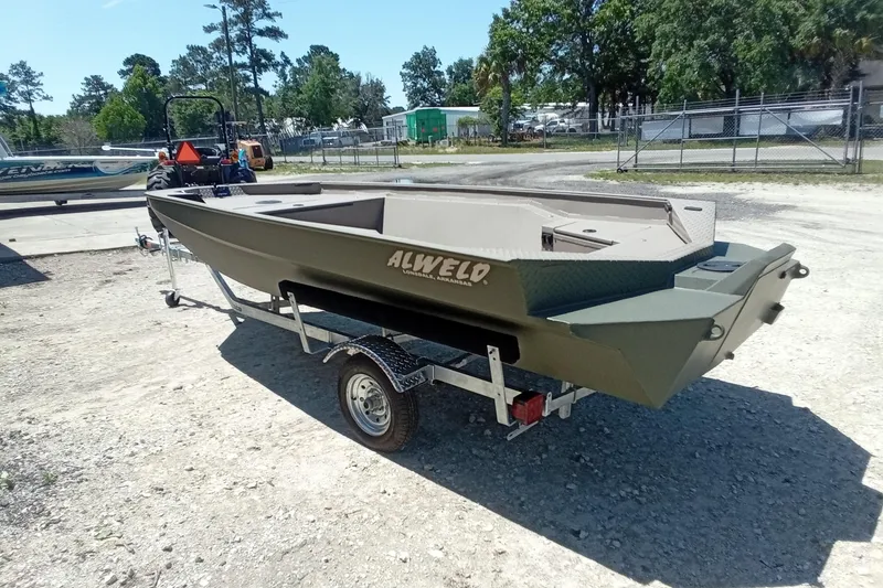 Slide: The Image of 2026 Alweld 1652 Invader boat on trailer, parked outdoors. - 8
