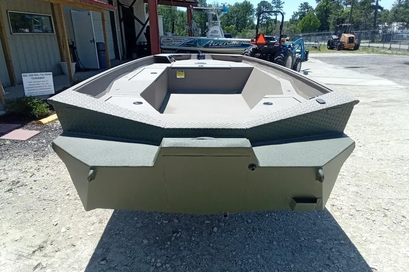 Slide: The Image of 2026 Alweld 1652 Invader boat displayed outdoors, showcasing its sturdy design. - 9