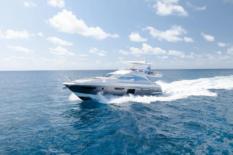 Slide: The Image of Luxury Azimut Fly 72 yacht cruising on open sea under clear blue sky. - 1