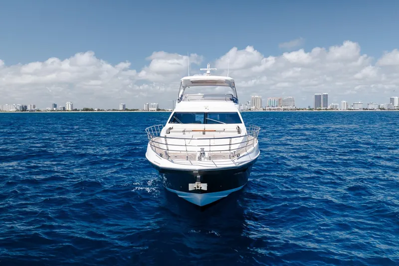 Slide: The Image of Azimut Fly 72 yacht on open sea with city skyline in background. - 11