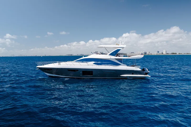 Slide: The Image of Luxury 2017 Azimut Fly 72 yacht cruising on open blue sea under clear skies. - 12