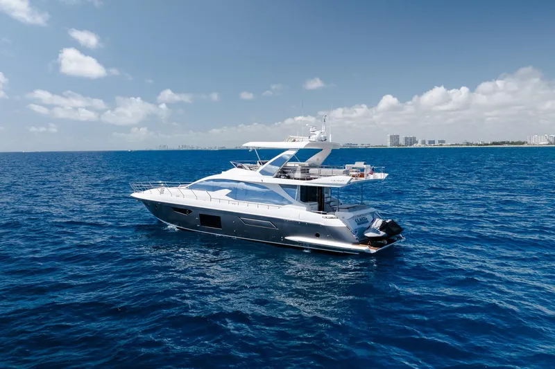 Slide: The Image of Luxurious 2017 Azimut Fly 72 yacht cruising on open blue sea under clear skies. - 17