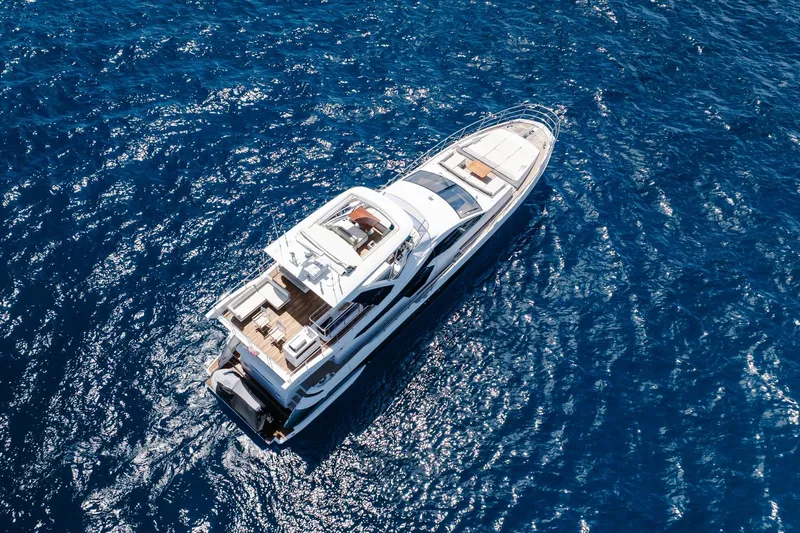 Slide: The Image of Aerial view of 2017 Azimut Fly 72 yacht cruising on deep blue ocean waters. - 19