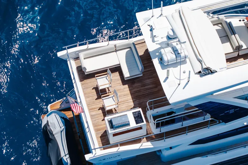 Slide: The Image of Aerial view of 2017 Azimut Fly 72 yacht deck with seating and ocean backdrop. - 21