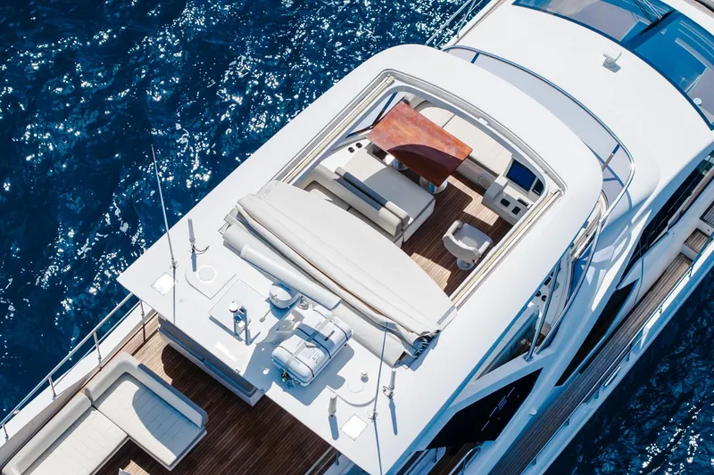 Slide: The Image of Aerial view of 2017 Azimut Fly 72 yacht on blue ocean water. - 22