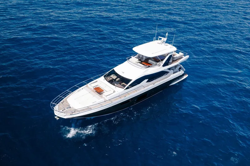 Slide: The Image of Aerial view of 2017 Azimut Fly 72 yacht cruising on open blue sea. - 23