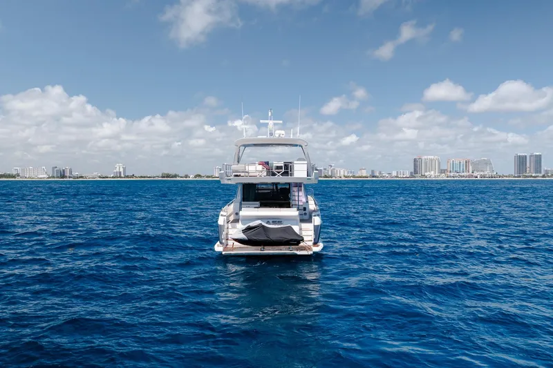 Slide: The Image of Azimut Fly 72 yacht on open sea with city skyline in background, 2017 model. - 25