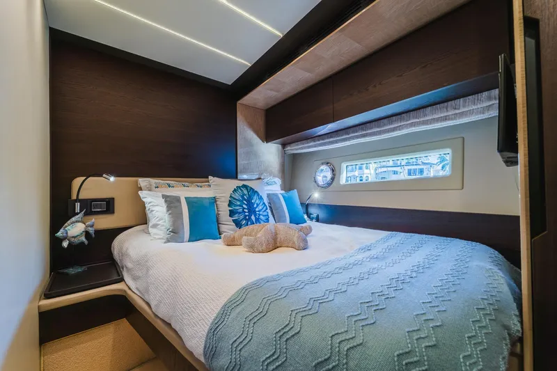 Slide: The Image of Luxurious bedroom interior of 2017 Azimut Fly 72 yacht with elegant bedding and window view. - 43