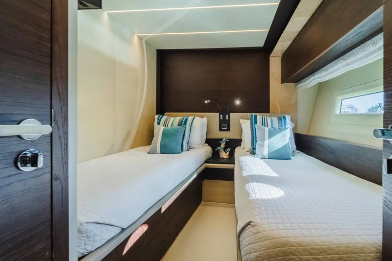 Slide: The Image of Luxurious twin cabin interior on 2017 Azimut Fly 72 yacht, featuring elegant bedding and decor. - 46