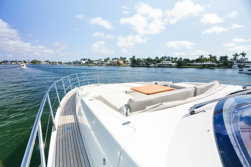 Slide: The Image of Luxurious 2017 Azimut Fly 72 yacht cruising on a sunny day, featuring spacious deck seating. - 57