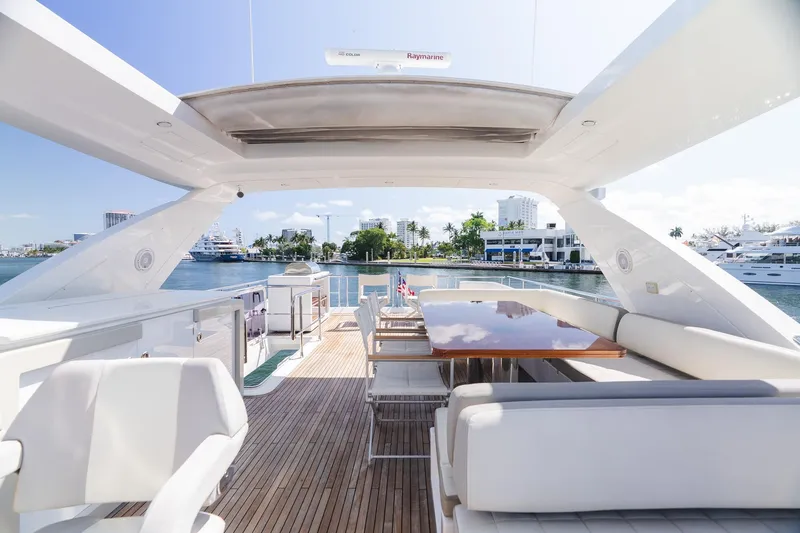 Slide: The Image of Luxurious 2017 Azimut Fly 72 yacht deck with elegant seating and waterfront view. - 67