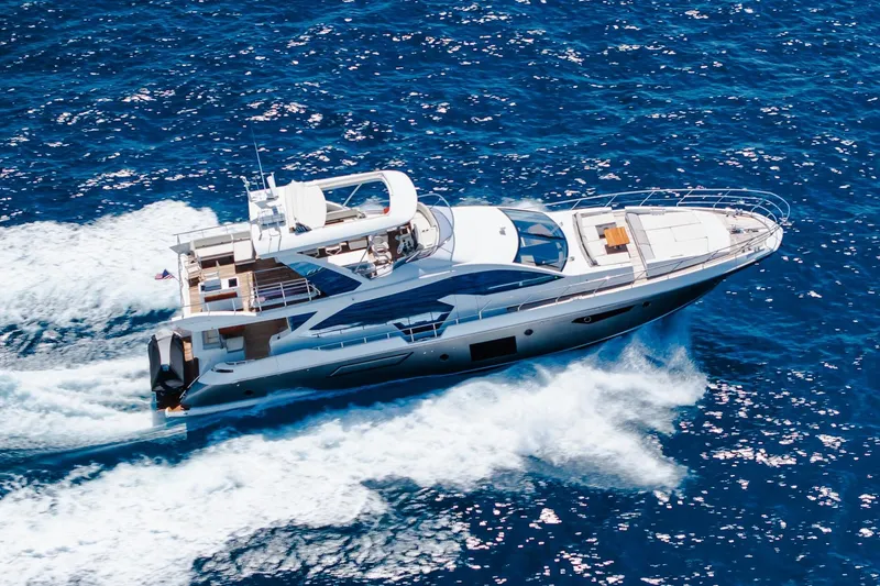 Slide: The Image of Luxurious 2017 Azimut Fly 72 yacht cruising on open blue sea. - 7