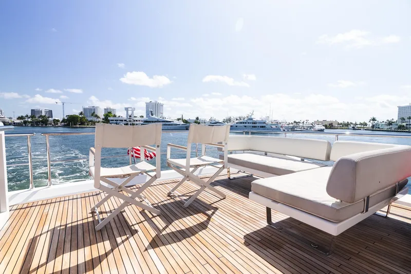 Slide: The Image of Luxury deck of 2017 Azimut Fly 72 yacht with seating, overlooking marina. - 70