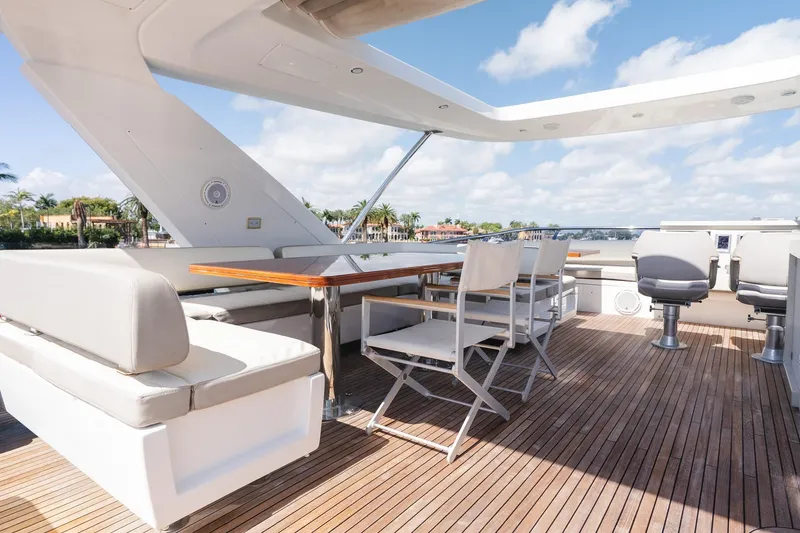 Slide: The Image of Luxurious 2017 Azimut Fly 72 yacht deck with seating and dining area. - 73