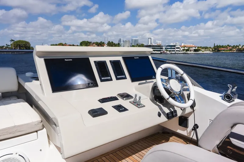 Slide: The Image of Cockpit of 2017 Azimut Fly 72 yacht with modern navigation equipment and steering wheel. - 79