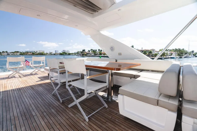 Slide: The Image of Luxurious 2017 Azimut Fly 72 yacht deck with seating, overlooking serene waterfront views. - 82
