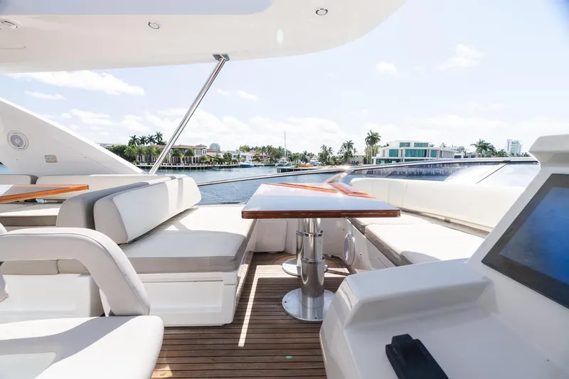 Slide: The Image of Luxurious 2017 Azimut Fly 72 yacht deck with elegant seating and waterfront view. - 83
