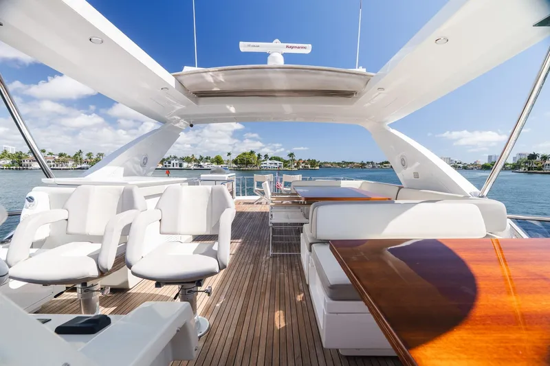 Slide: The Image of Luxurious 2017 Azimut Fly 72 yacht interior with elegant seating and scenic waterfront view. - 84
