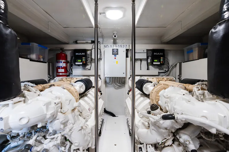 Slide: The Image of Engine room of a 2017 Azimut Fly 72 yacht, featuring dual MAN engines. - 89