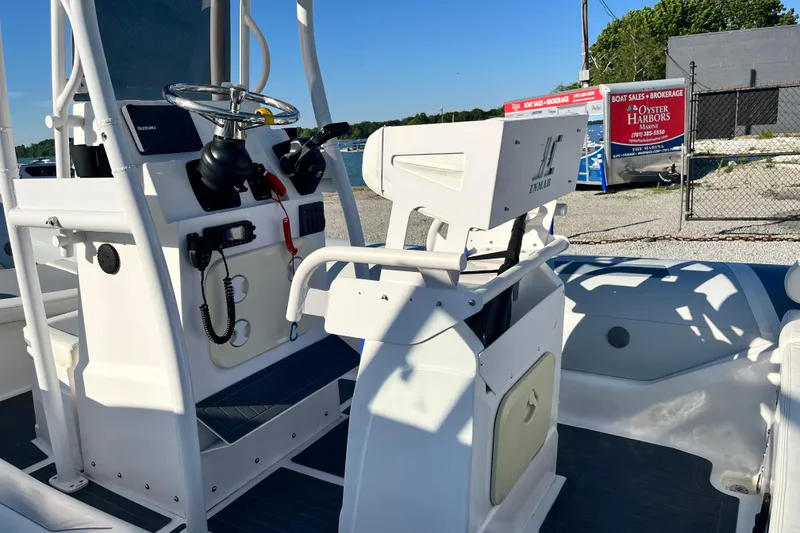 Slide: The Image of 2023 Inmar 550R-YS Yacht Series boat interior with steering console and seating. - 11