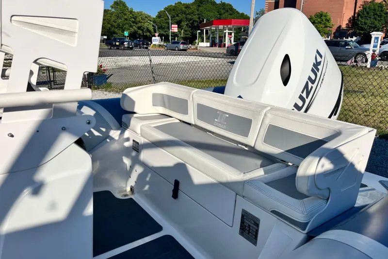 Slide: The Image of 2023 Inmar 550R-YS Yacht Series with Suzuki engine, featuring sleek seating and modern design. - 12