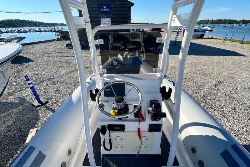 Slide: The Image of 2023 Inmar 550R-YS Yacht Series boat at marina, steering console view. - 18