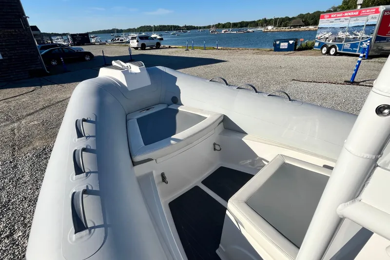 Slide: The Image of 2023 Inmar 550R-YS Yacht Series inflatable boat docked by the waterfront. - 20