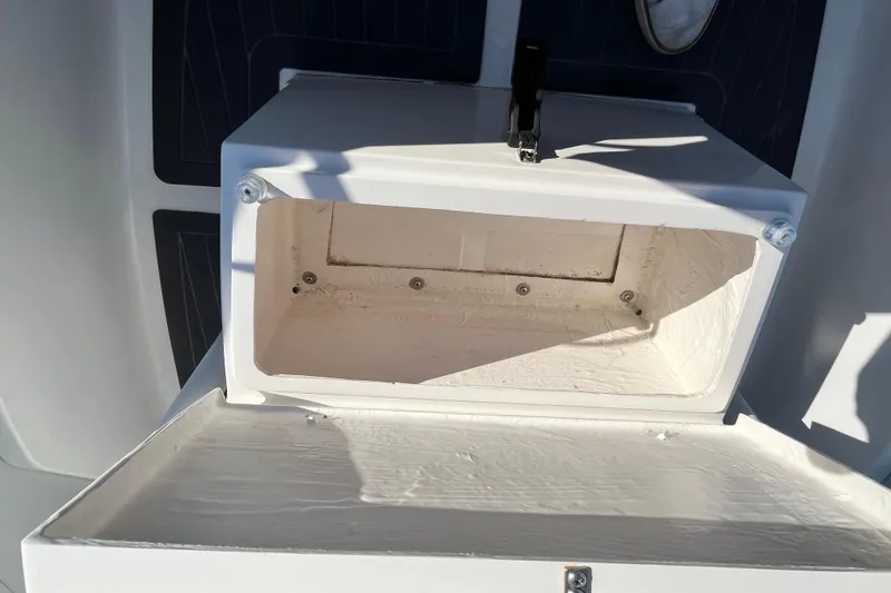 Slide: The Image of Open storage compartment on 2023 Inmar 550R-YS Yacht Series boat. - 23
